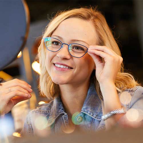 Woman trying on glasses